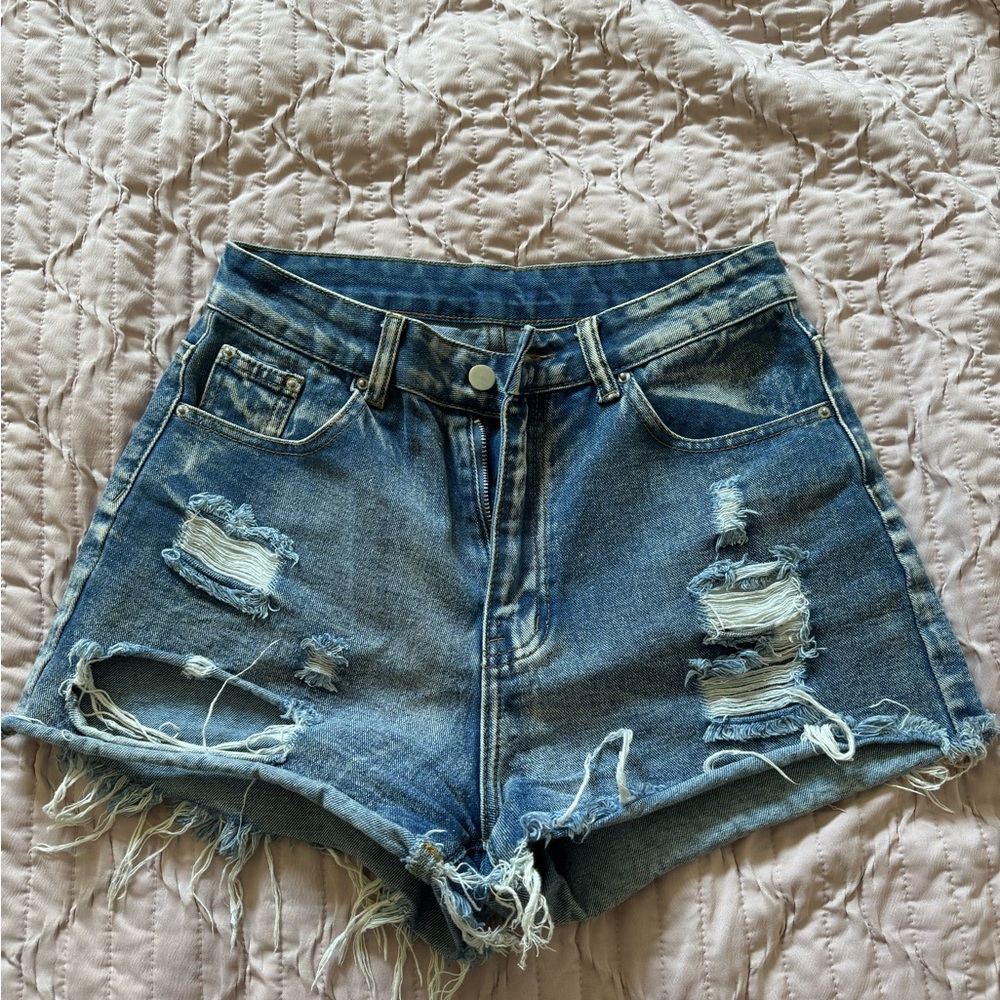 SHEIN distressed denim shorts.